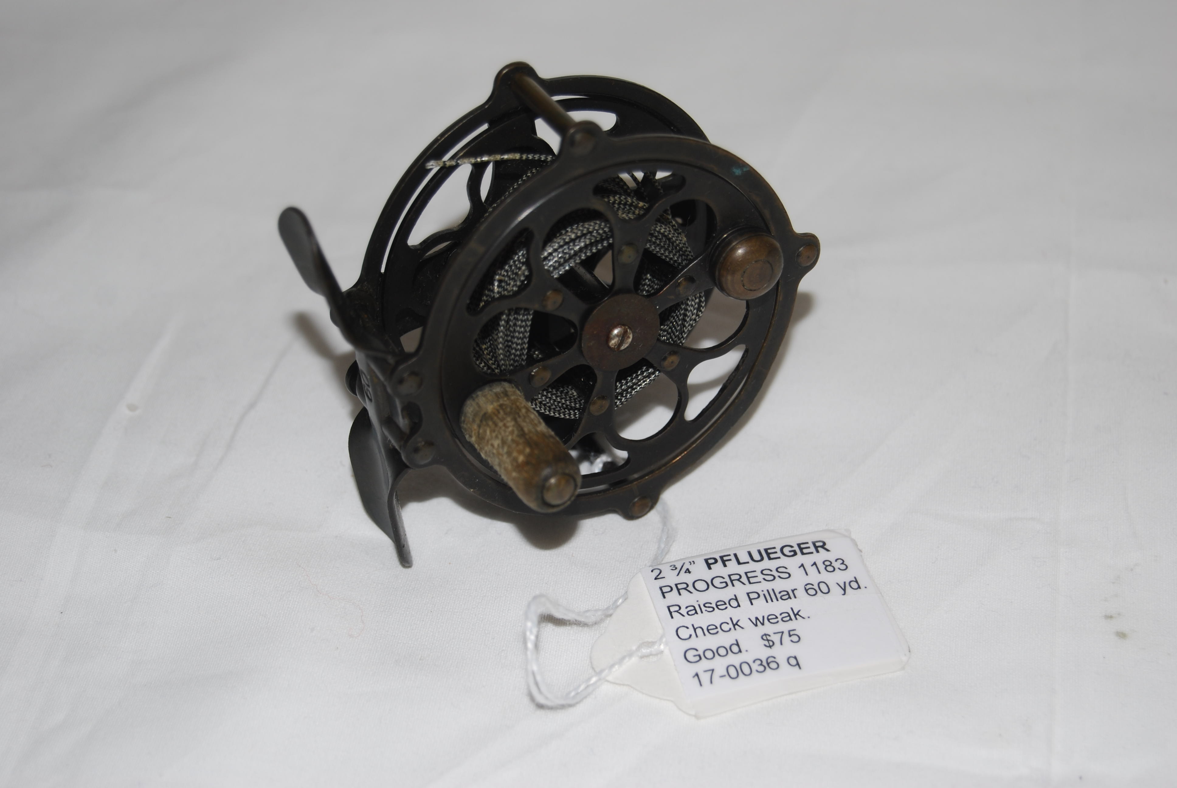 Image for 2 3/4” PFLUEGER PROGRESS 1183 Raised Pillar. 60 yd. Satin gun metal finish. Wood Knob. Circa 1916-1940. SOLD